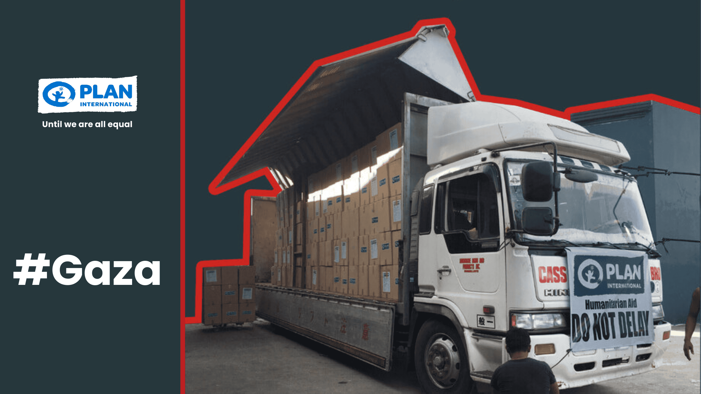 Humanitarian aid truck with Plan International banner